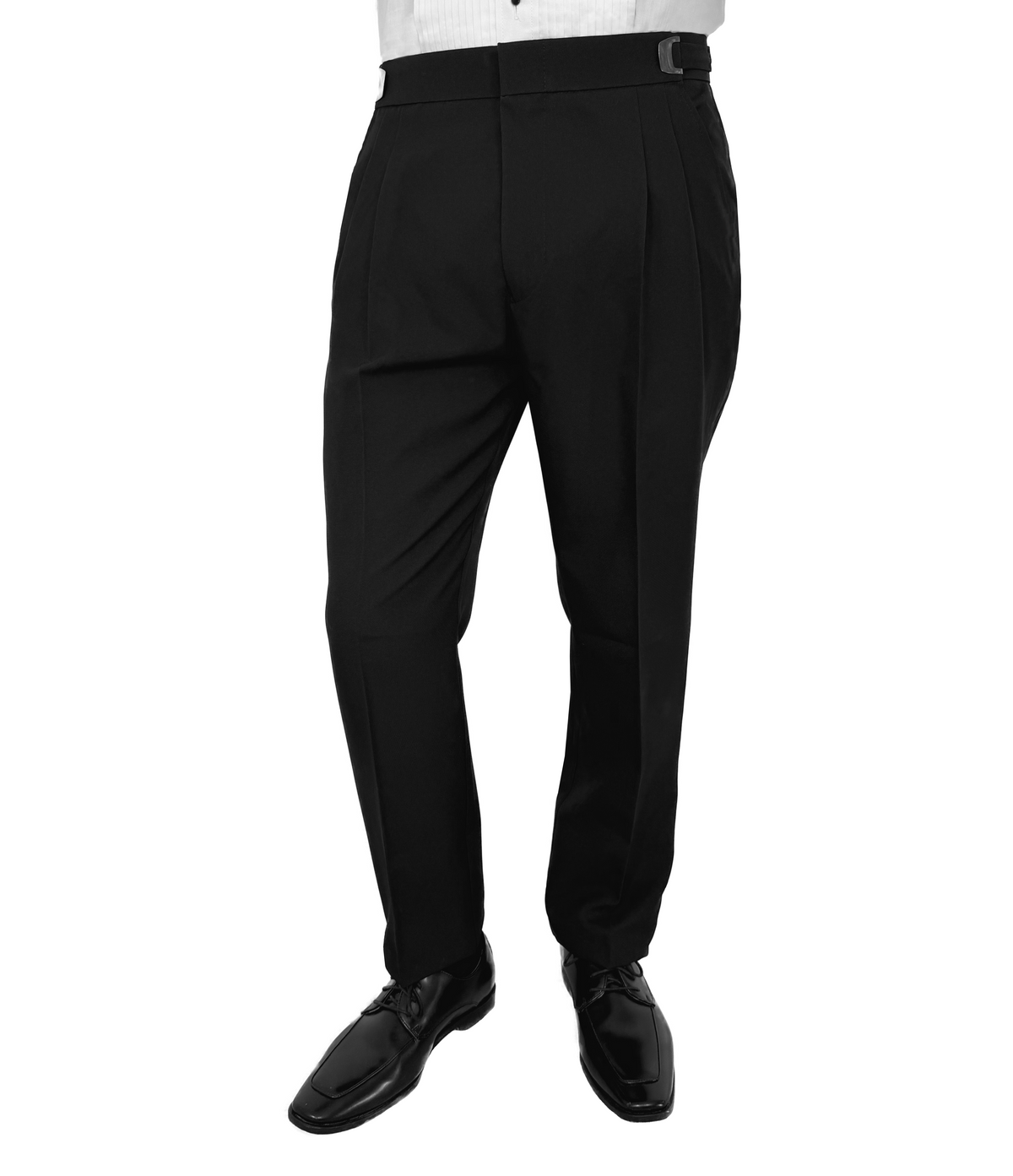 Black pleated dress pants shown on a model from the waist down, paired with a white shirt and black dress shoes against a plain white background.