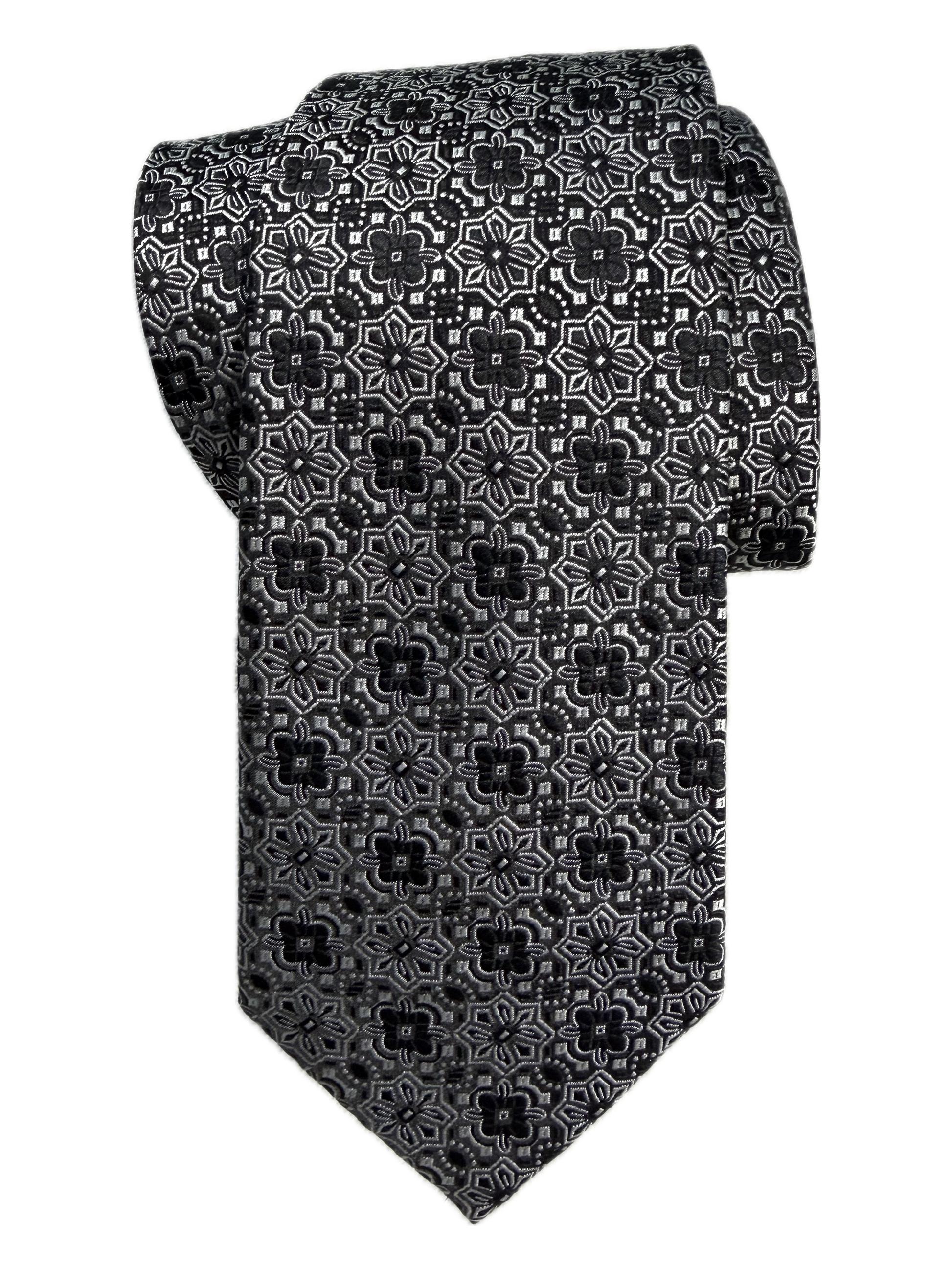 A rolled black and silver floral medallion-patterned tie on a white background