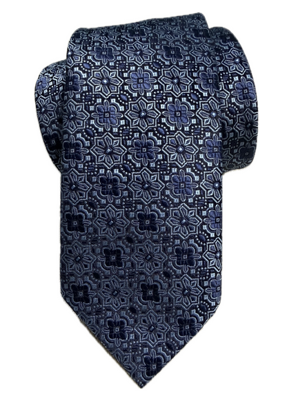 A rolled navy blue floral medallion-patterned tie on a white background