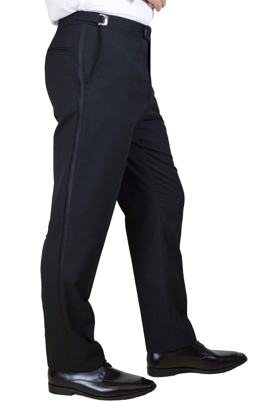 A side-view of a modeled pair of men's black tuxedo pants with a satin stripe and an adjustable waistband
